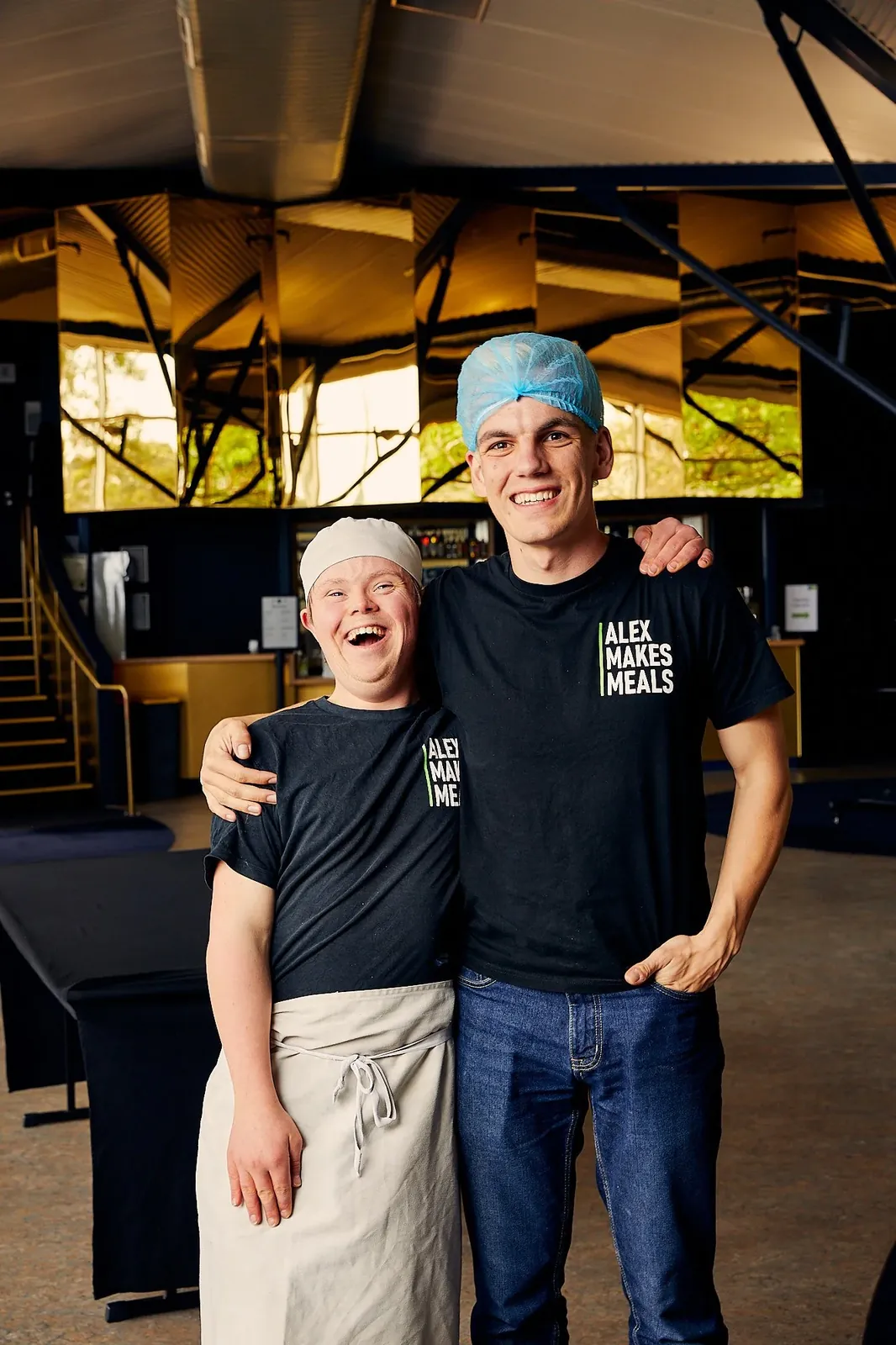 Alex with a volunteer at Alex Makes Meals