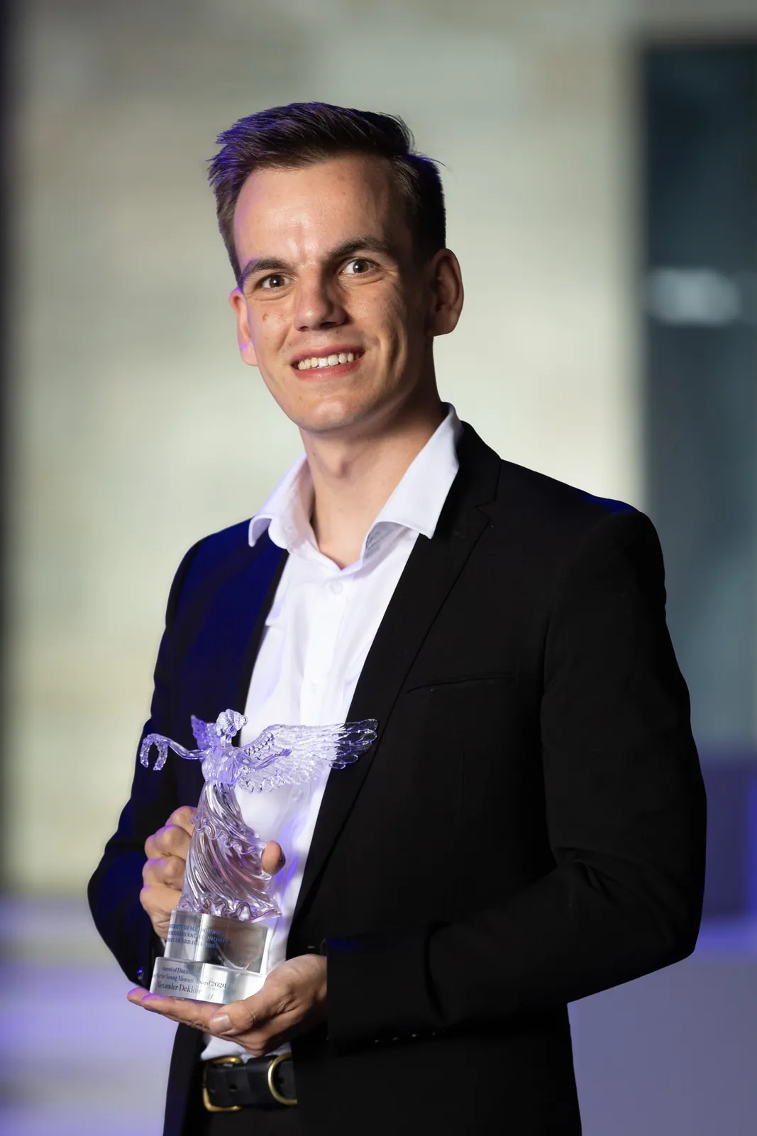 Alex with the 2026 University of Melbourne Alumni of Distinction award