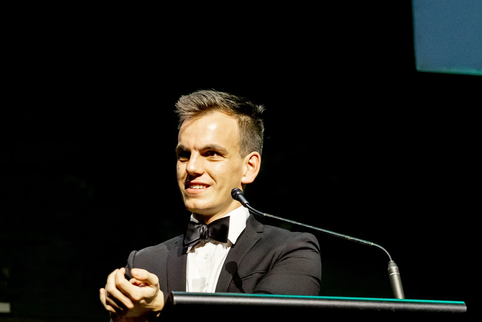 Alex speaking at the 2026 Feast To Feed gala